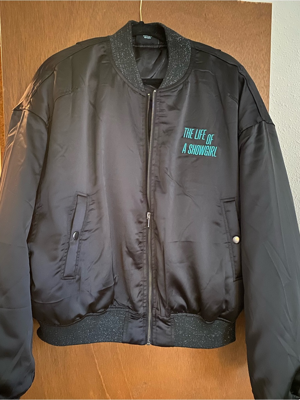 Taylor Swift Black Bomber Jacket with Teal Script